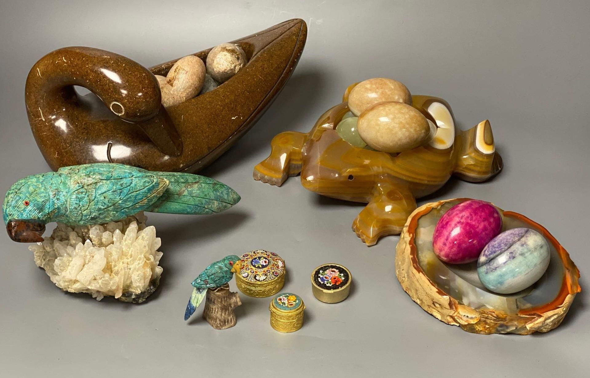 A Shona soapstone dish/duck containing eggs, a turquoise parrot on stand and various hardstone carvings and boxes